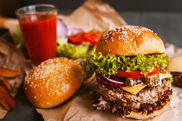 Delicious fresh homemade burger on a wooden table