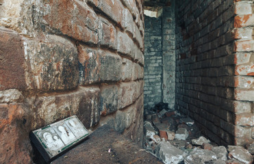 Inside in the old, burnt, destroyed, abandoned church with brick walls