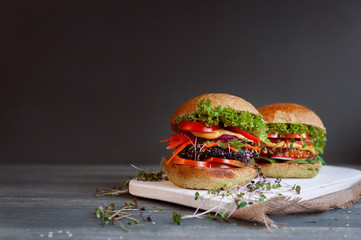 veggie burger on a black wooden background
