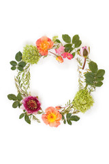 Floral round crown (wreath) with flowers and leaves. Flat lay