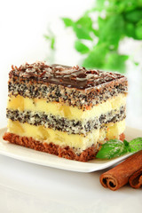 Poppy seed cake with pineapple on the white background