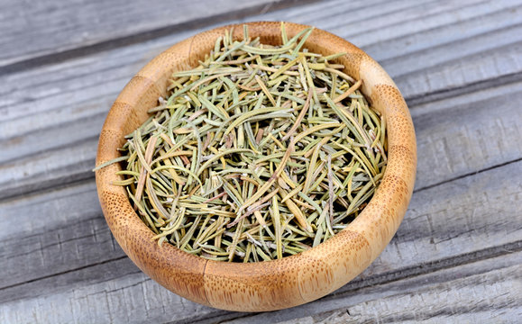 Rosemary in a bamboo bowl on table