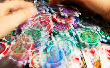 Royal flash win in poker and female hands grabbing bank. Blurred motion.