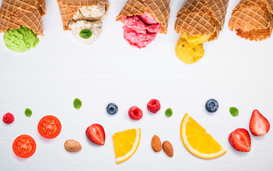 Colorful ice cream with cones and various fruits raspberry ,blue