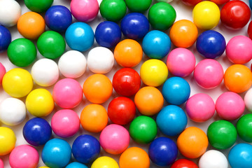 Fototapeta na wymiar Colorful background of assorted shiny round gumballs