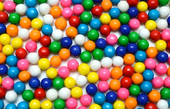 Colorful background of assorted shiny round gumballs