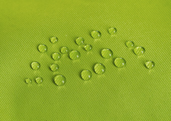 Green waterproof fabric with waterdrops