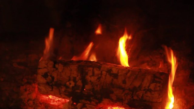 Beech Log burning - slow flames - blurring out slow