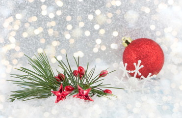 red christmas balls in snow