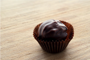 Handmade chocolates on a wooden base