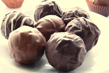 Handmade chocolates on white plate Image ID:533915773