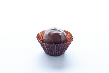 Handmade chocolates on a white background