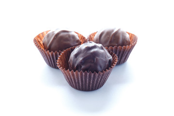 Handmade chocolates on a white background