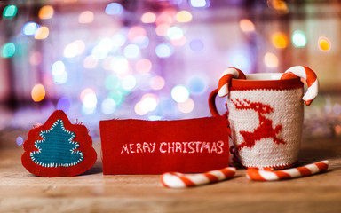 Cup with Christmas ornament and the words 