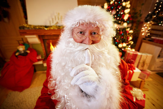 Real Santa Claus gesturing shhh