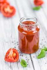 Tomato Ketchup (selective focus) on vintage wooden background