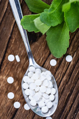 Stevia sweetener on wooden background