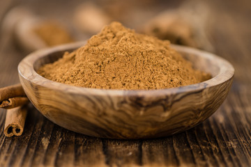 Wooden table with Cinnamon (selective focus)