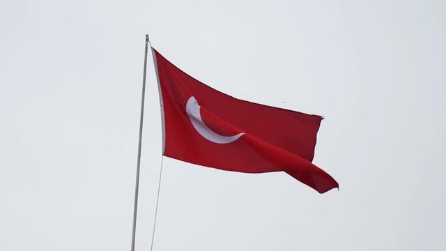 turkish flag fluttering on a ship sailing the Dardannelles, detail