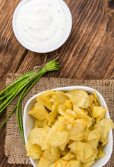 Potato Chips (Sour Cream taste) on vintage wooden background