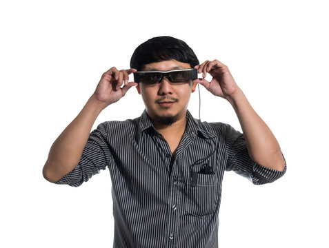 Young man wearing smart high tech glasses and looking, business