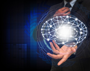 Businessman hand holding the brain over the Technical informatio