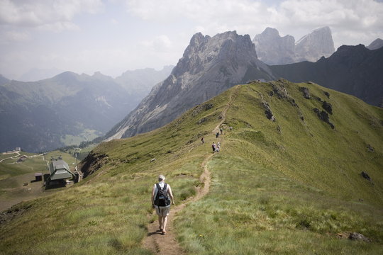 Walkers on footpath, Marmolada mountain, Dolomites