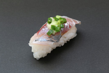 Japanese horse mackerel sushi on black background
