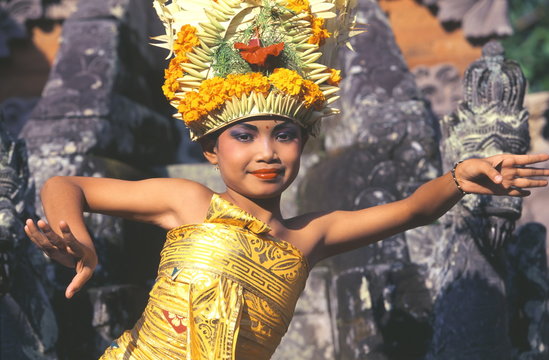 Legong dancer in action smiling, Bali, Indonesia