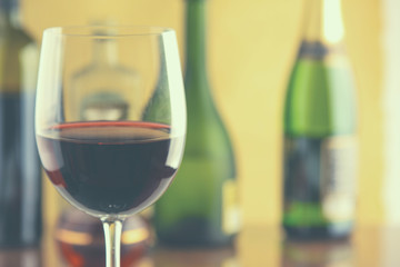 Glass of red wine and the bottle