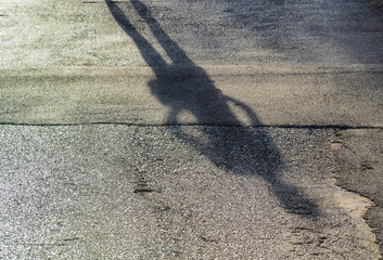 Retro color/ Shadow of a men on street concrete background with place your text/ Abstract image
