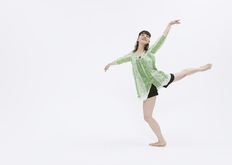 Fototapeta na wymiar Young woman dancing