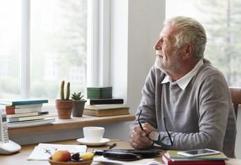 Senior Adult Looking Outside WIndow Relax Concept