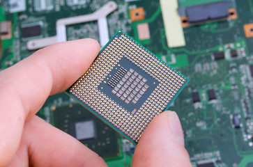 cpu processor installation of electronic circuit board close-up 