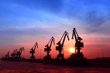 Port gantry crane at work, in the cargo terminal