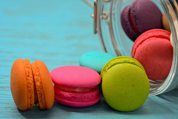 French delicious dessert macaroons on wooden table