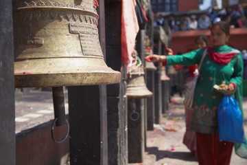 Woman ringing bell, Manakamana Temple, Manakamana, Gorkha District, Gandaki, Nepal