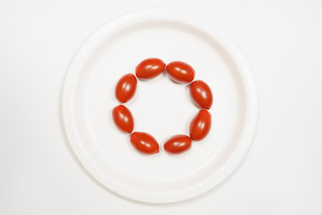Mini Cherry Tomatoes on a white plate with white background