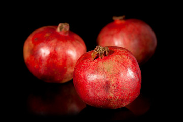 Fototapeta na wymiar Ripe pomegranates on a black background