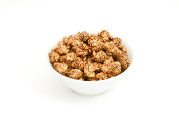 Chocolate popcorn in white Bowl on white background.