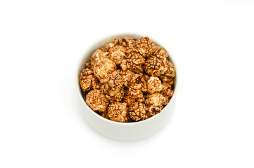 Chocolate popcorn on white background. center