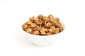 Chocolate popcorn on white background.