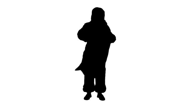 Silhouette Real Santa Claus carrying big bag full of gifts 