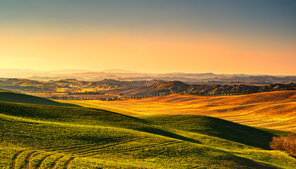 Fototapeta na wymiar Tuscany countryside misty panorama, rolling hills. Italy