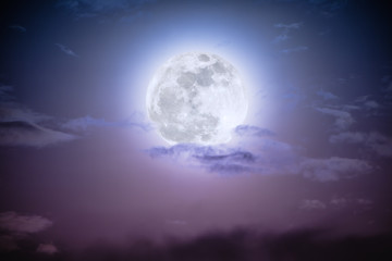 Fototapeta na wymiar Nighttime sky with clouds and bright full moon.