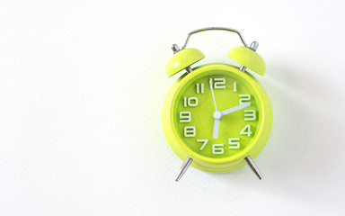 Alarm clock green on white background