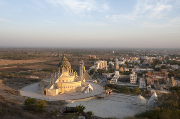 Jain temple, newly constructed, at the foot of Shatrunjaya Hill, in the early morning sunshine, Palitana, Gujarat