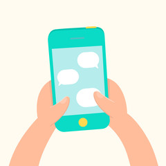 Hands holding smartphone and messaging.