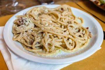 spaghetti ala carbonara on white plate