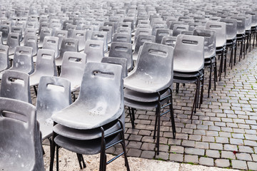 Fototapeta premium many old empty plastic chairs on urban square